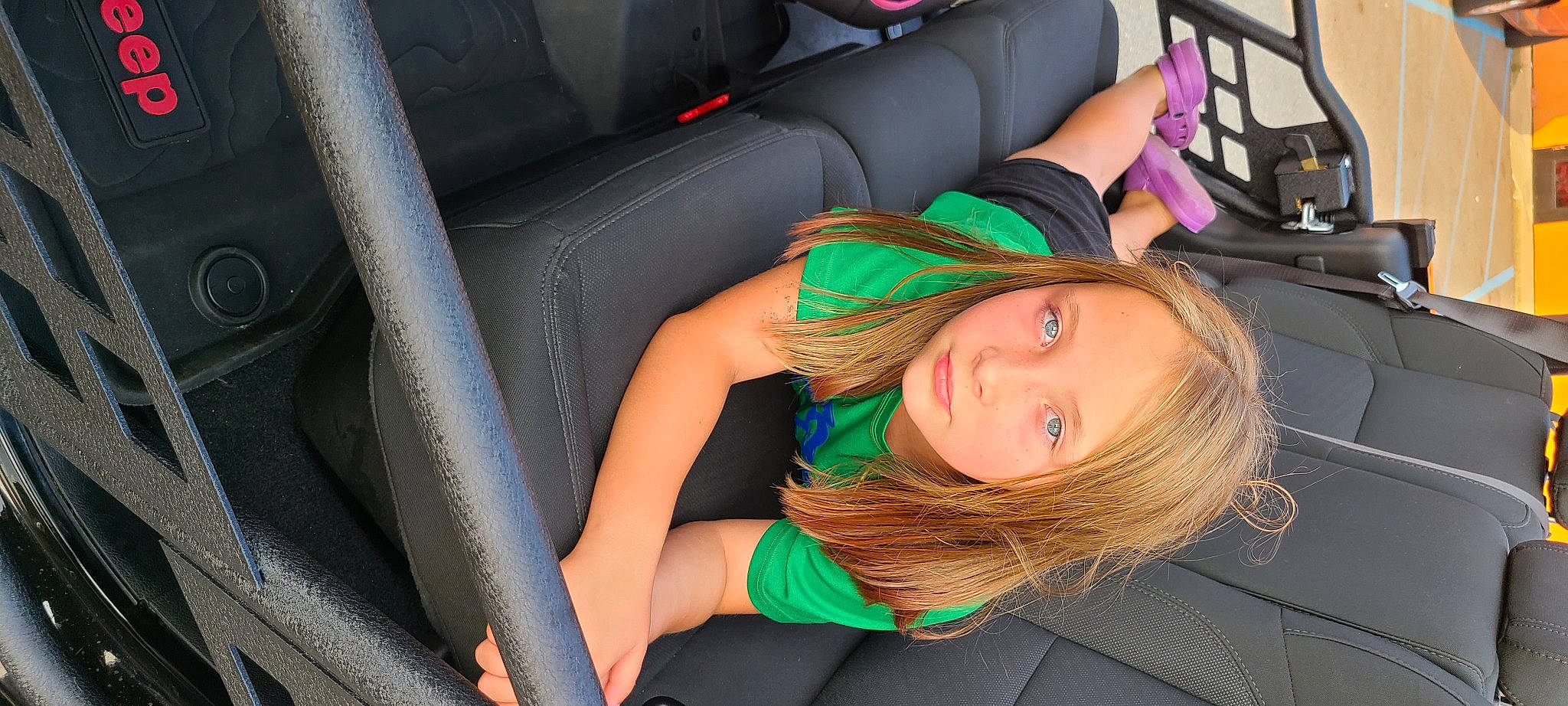 Kaylynn is registered to the contest to win money with this photo: auto_part, automotive_design, black_hair, car, car_seat, car_seat_cover, comfort, cool, electric_blue, hairstyle, human_body, human_leg, leg, long_hair, motor_vehicle, mouth, person, personal_luxury_car, thigh, vehicle