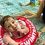 Ambre participe au concours pour gagner de l'argent avec cette photo : toddler, child, swimming_pool, float_ring, swimtrainer, goggles, water, adult, support, play, fun, safety, wet_hair, blue_eyes, pink_clothing, summer, recreation, family, splash, happy