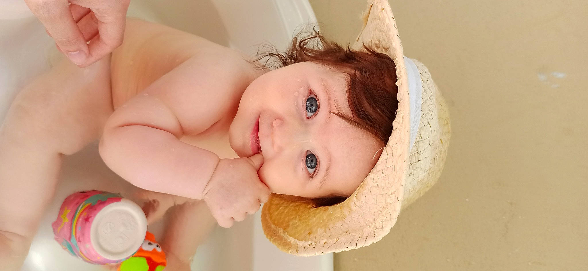 Lena participe au concours pour gagner de l'argent avec cette photo : baby, baby_playing_with_toys, baby_products, baby_toddler_clothing, bathing, brown_hair, child, eyelash, fashion_accessory, fun, happy, headpiece, iris, jewellery, joy, lip, nose, person, skin, smile
