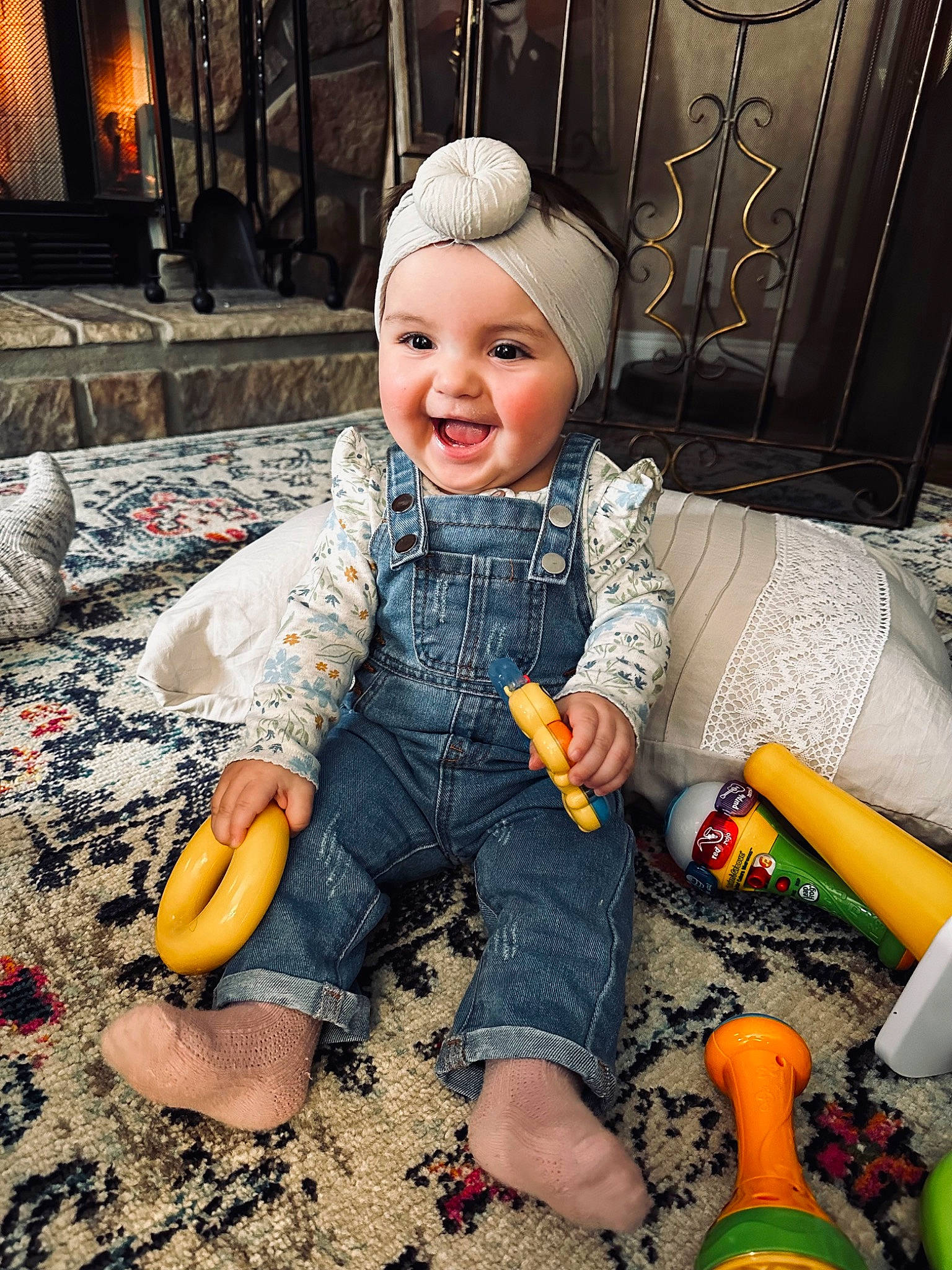 River joined the competition — help win amazing prizes! baby, baby_toddler_clothing, beanie, child, flooring, fun, fur, happy, headwear, joy, lap, laugh, leisure, orange, person, play, pumpkin, sitting, smile, soil