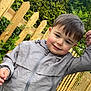 Sonny joined the competition — help win amazing prizes! child, boy, outdoor, jacket, smile, fence, greenery, hand, person, face, hair, tree, nature, young, casual_clothing, happy, daylight, portrait, skin, holding_hand