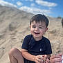 Sonny joined the competition — help win amazing prizes! child, boy, sand, beach, smile, happy, outdoor, sky, clouds, short_hair, tshirt, playing, summer, nature, fun, casual_clothing, person, daytime, sand_on_skin, relaxed