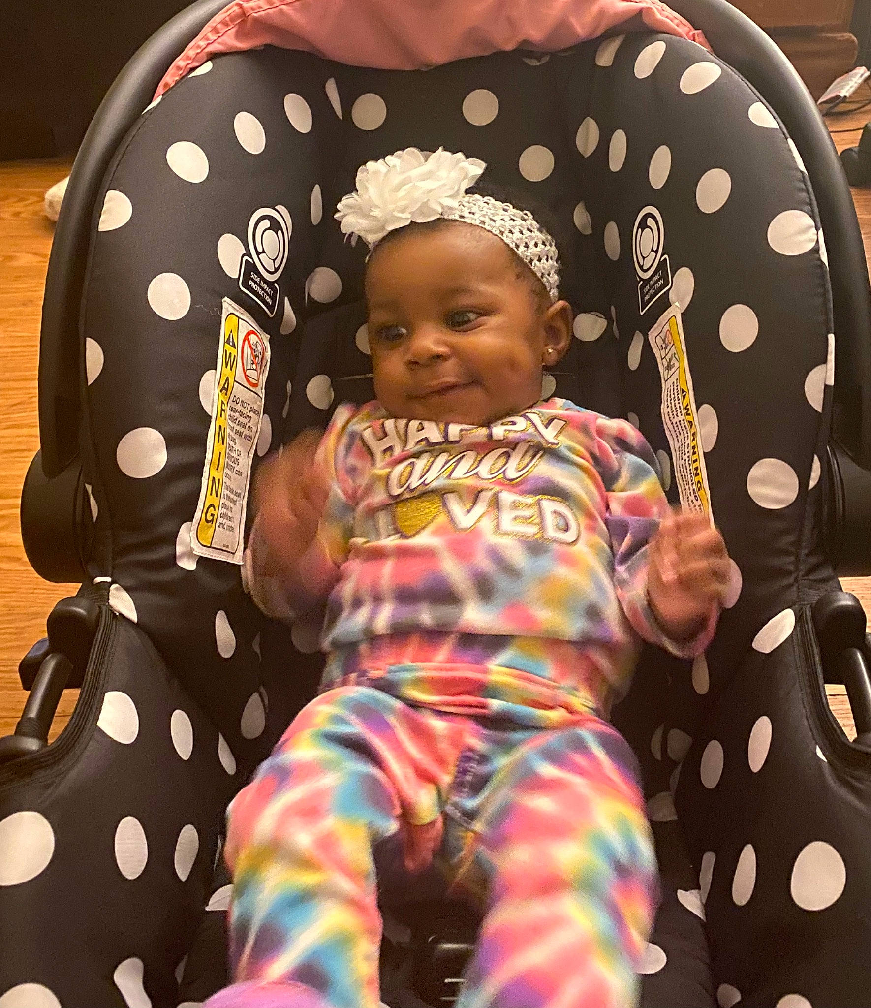 Nailani is registered to the contest to win money with this photo: baby, baby_toddler_clothing, child, comfort, cool, facial_expression, fashion, fun, hairstyle, happy, mammal, orange, outerwear, people, person, pink, sleeve, t_shirt, textile, toddler