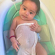 Noeleah is registered to the contest to win money with this photo: accessories, baby, bathing, bathroom, bathtub, bracelet, childbirth, clothing, face, hair, head, indoors, infantbed, person, photography, portrait, room, sitting, sleeve, tub