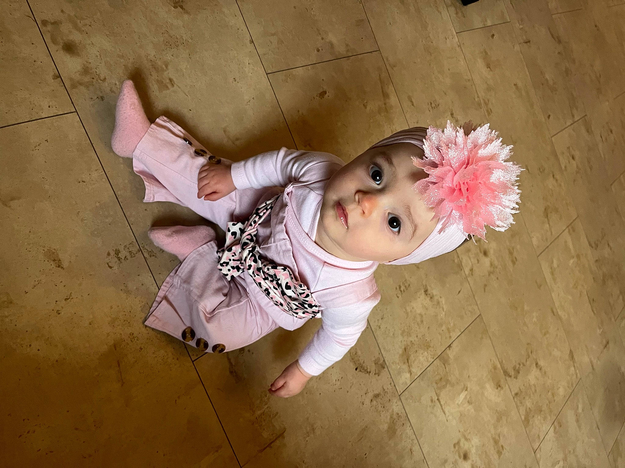Lexie participe au concours pour gagner de l'argent avec cette photo : baby, baby_toddler_clothing, bangs, cheek, child, concrete, eye, flesh, flooring, fun, fur, happy, headpiece, headwear, magenta, person, pink, sitting, skin, toddler