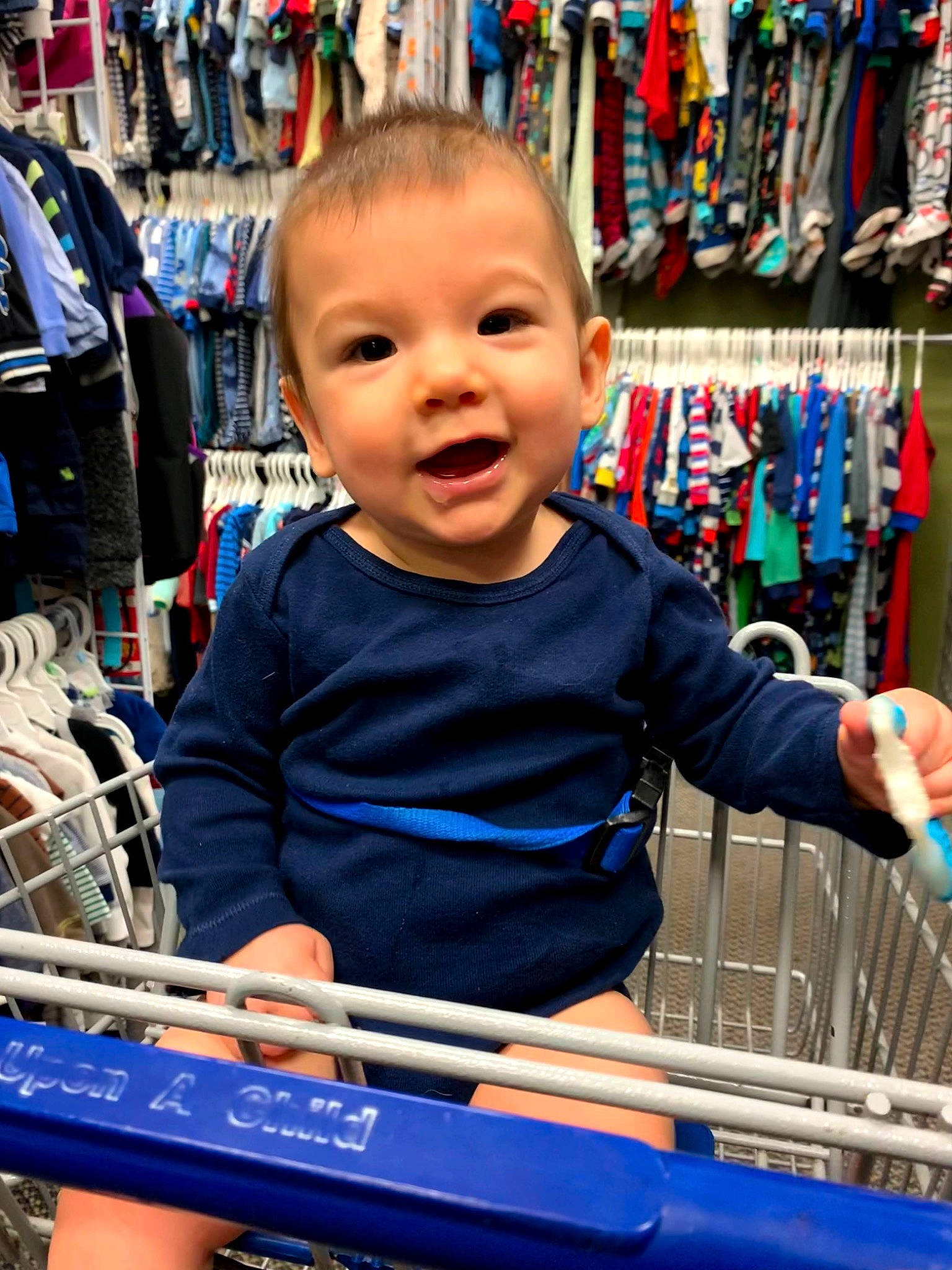 Lincoln is registered to the contest to win money with this photo: blue, cart, child, city, customer, electric_blue, fun, leisure, market, person, recreation, retail, shelf, shopping, shopping_cart, smile, sportswear, standing, t_shirt, toddler