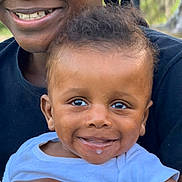 Dequalin joined the competition — help win amazing prizes! affection, baby, blue_shirt, braids, candid, child, closeup, clothing, drool, expression, face, family, happy, holding, joy, outdoor, person, portrait, skin, smile