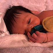 Malachi joined the competition — help win amazing prizes! baby, newborn, pacifier, blanket, sleepy, close_up, hand, face, soft_texture, pink, towel, hair, skin, resting, cozy, portrait, nursery, small_fingers, cuddly, relaxed