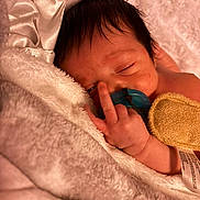 Malachi joined the competition — help win amazing prizes! baby, newborn, pacifier, blanket, satin, towel, sleeping, hand, middle_finger, hair, face, close_up, cozy, indoor, plush, skin, portrait, swaddle, bedding, infant