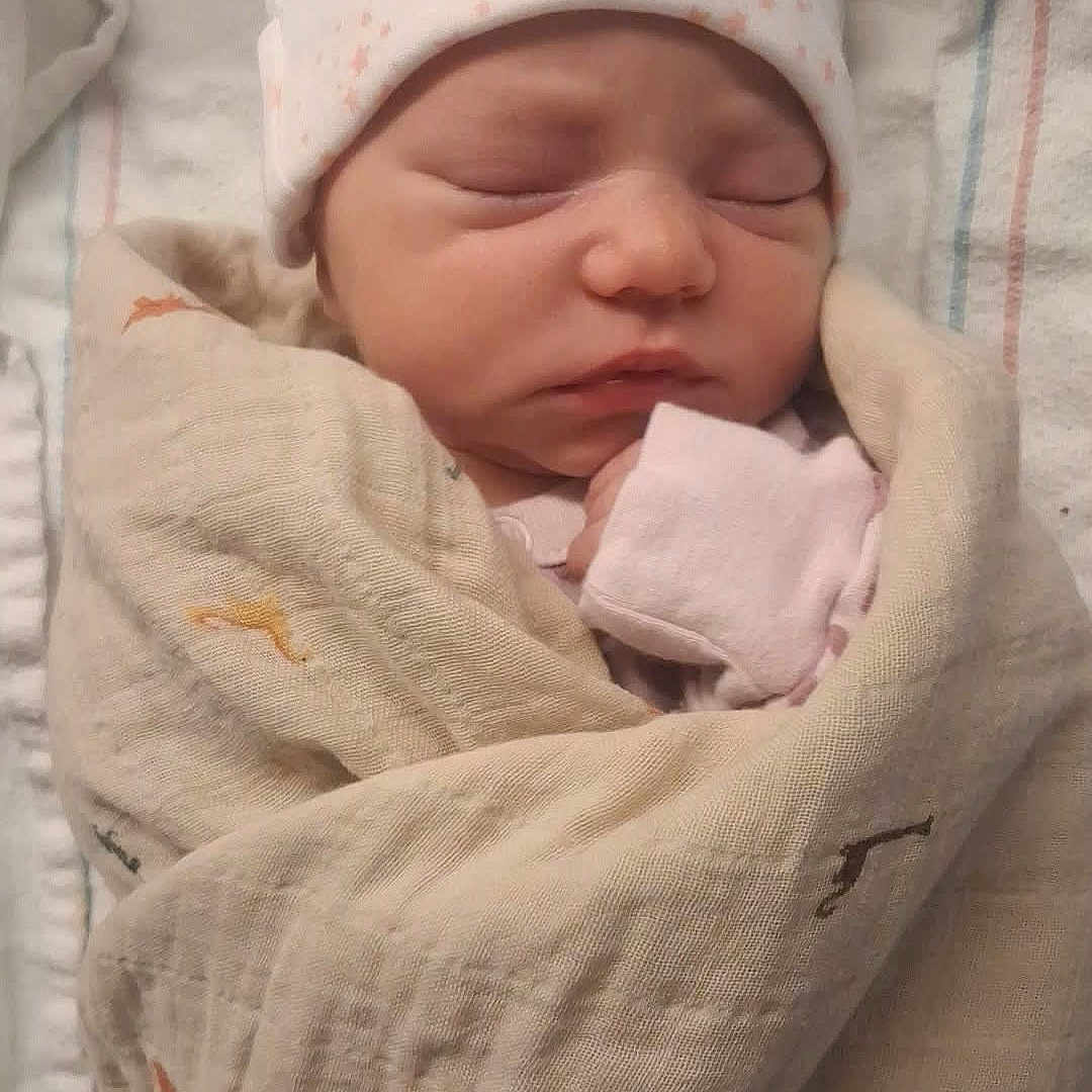 Praisely Mackenzie joined the competition — help win amazing prizes! baby, bed, blanket, child, cozy, cute, fabric, hat, indoors, infant, newborn, peaceful, pink, portrait, resting, sleeping, soft, swaddled, white, wrapped
