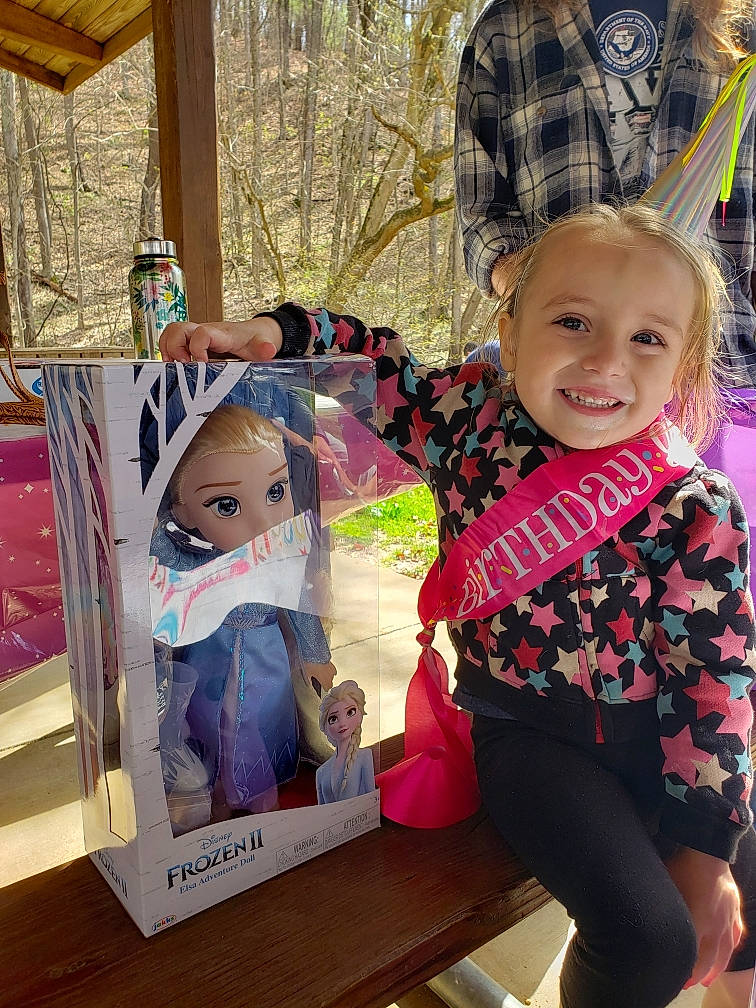 Selena is registered to the contest to win money with this photo: blond, cheek, child, doll, ear, face, happy, head, iris, joy, person, pink, product, skin, toddler, toy, vacation