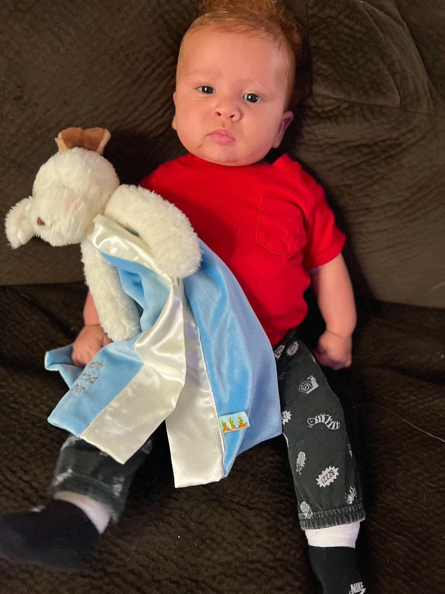 Rykeir is registered to the contest to win money with this photo: arm, baby, baby_toddler_clothing, barefoot, child, comfort, finger, gesture, human_leg, leg, person, product, shoulder, skin, sleeve, sportswear, t_shirt, thigh, thumb, toddler