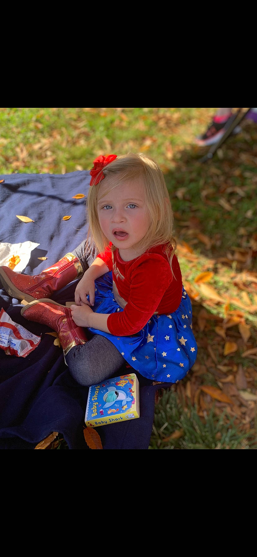 Taylor joined the competition — help win amazing prizes! baby_toddler_clothing, blond, brown_hair, child, dress, electric_blue, fawn, fun, grass, happy, head, leaf, leisure, orange, pattern, people_in_nature, person, plant, recreation, toddler