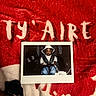 baby, blanket, car_seat, child, clothing, cute, fabric, hat, indoor, infant, jeans, person, photo, photograph, portrait, printed_photo, red, seat_belt, text, white
