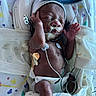baby, bed, blanket, care, child, cute, diaper, healthcare, hospital, infant, medical_equipment, monitoring, newborn, peaceful, person, premature, resting, sensor, sleeping, tiny
