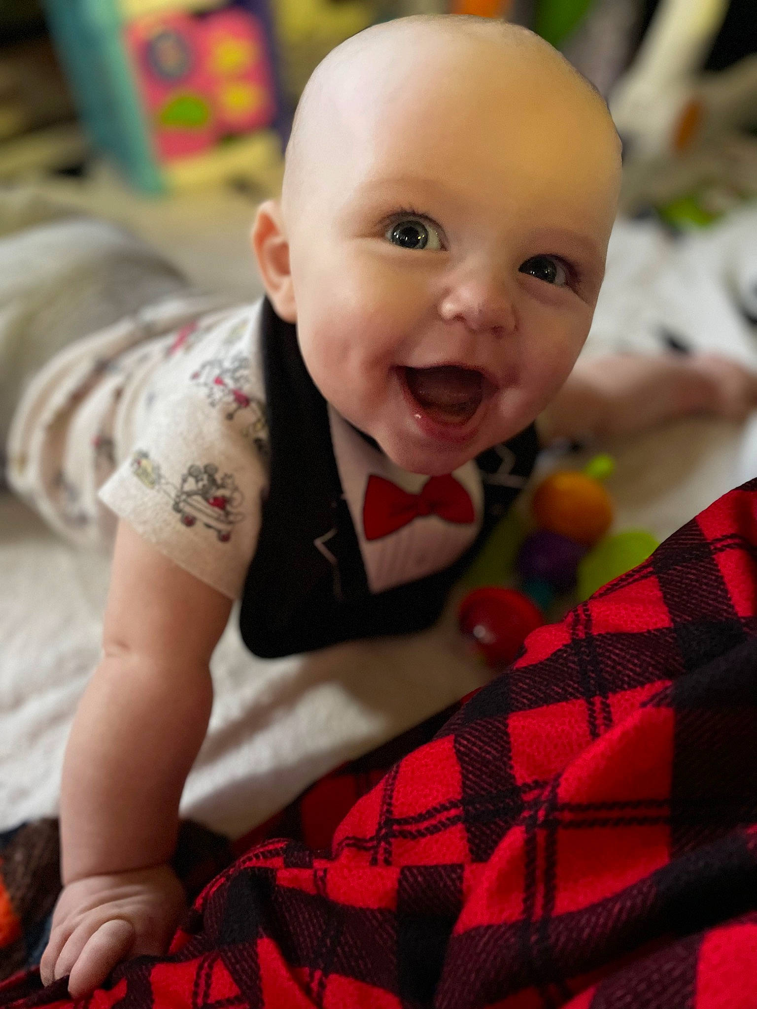 Hunter joined the competition — help win amazing prizes! baby, baby_toddler_clothing, carmine, cheek, child, facial_expression, finger, flooring, fun, happy, pattern, person, plaid, product, red, sitting, skin, smile, tartan, textile