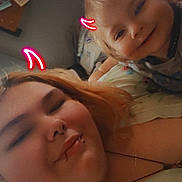 Everest is registered to the contest to win money with this photo: adult, child, smiling, face, portrait, indoor, bedroom, neon, doodle, devil_horns, happy, casual, clothing, person, closeup, family, fun, cute, light, warm_filter