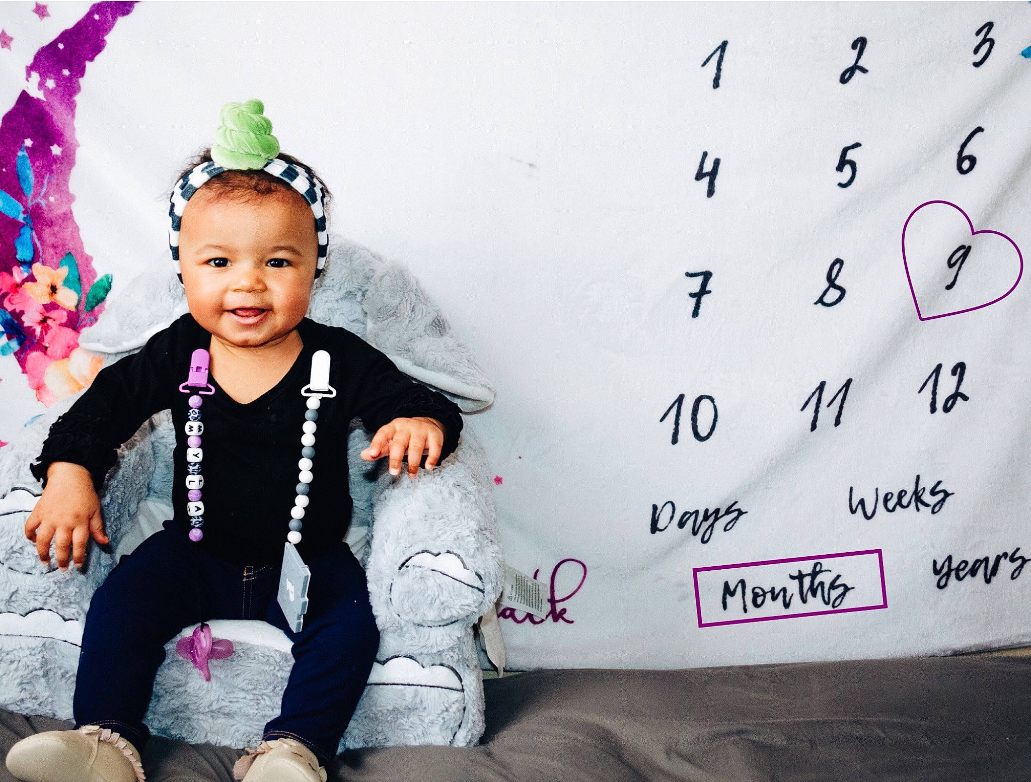 Myla is registered to the contest to win money with this photo: baby, baby_toddler_clothing, child, costume_hat, event, fashion_accessory, font, fun, happy, headpiece, jewellery, joy, magenta, pattern, person, photograph, pink, sleeve, smile, sock
