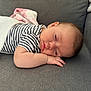 baby, blanket, child, comfort, couch, cozy, face, hand, head, indoors, infant, nap, peaceful, relax, rest, skin, sleeping, soft, striped_shirt, young