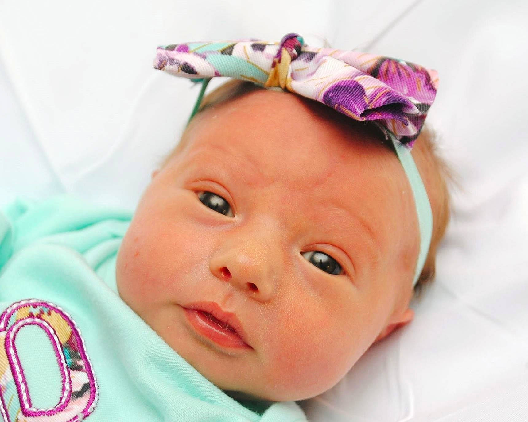 Addisyn is registered to the contest to win money with this photo: baby, cheek, child, ear, face, fashion_accessory, forehead, hair_accessory, head, headband, headgear, headpiece, person, pink, skin, smile, toddler