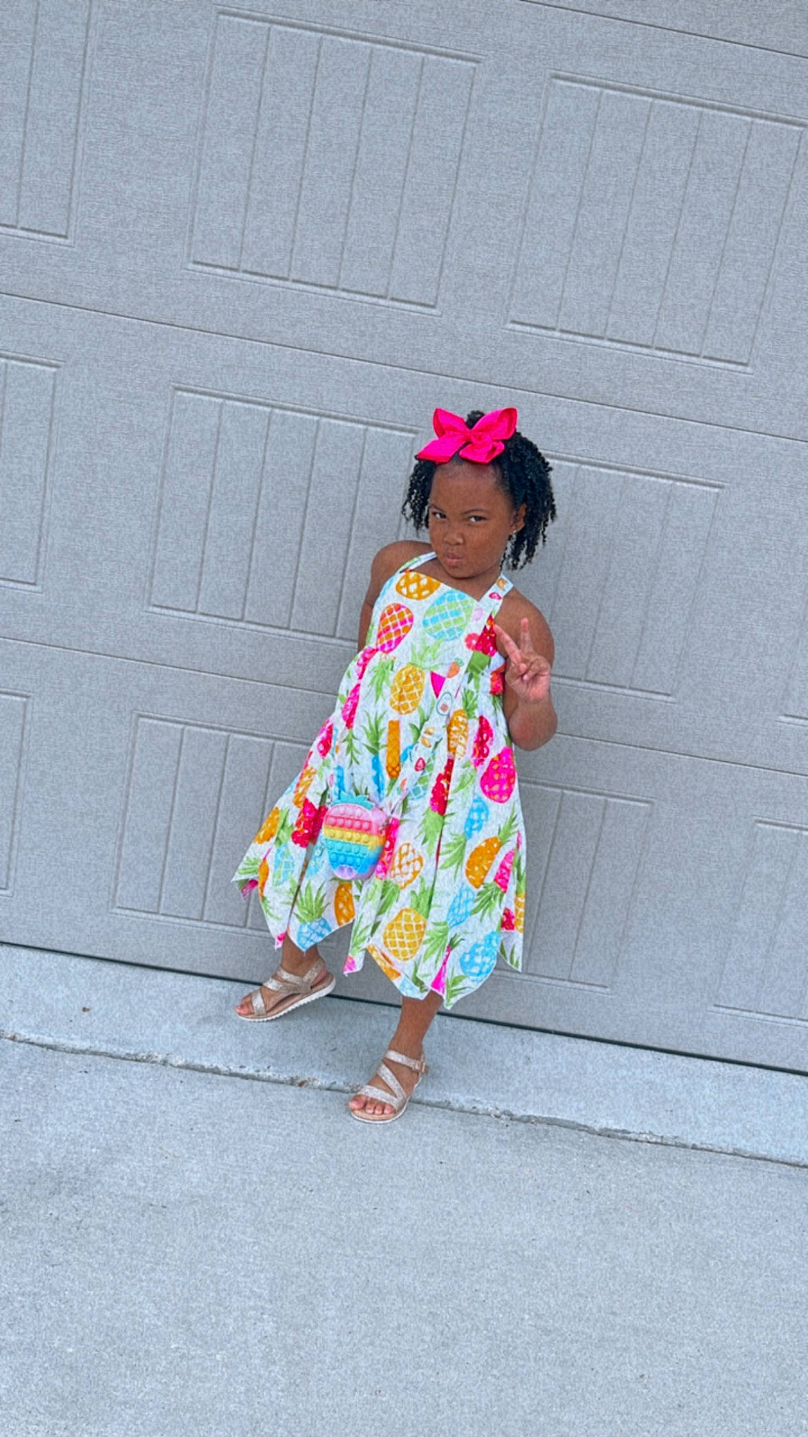 Noah is registered to the contest to win money with this photo: asphalt, baby_toddler_clothing, child, concrete, day_dress, dress, fashion_design, hat, human_leg, magenta, one_piece_garment, pattern, person, pink, road_surface, shadow, sleeve, sunglasses, toddler, waist