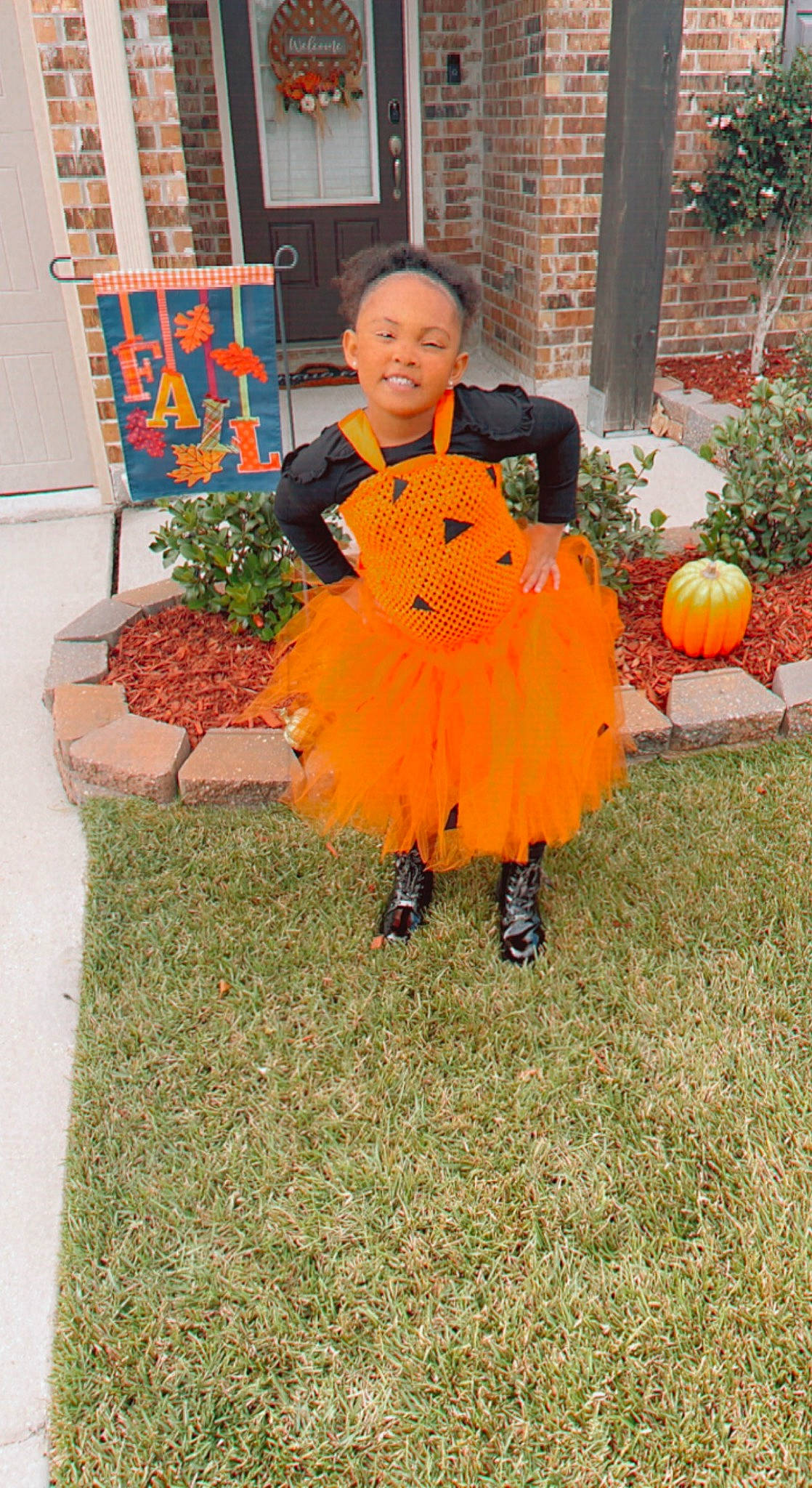 Noah is registered to the contest to win money with this photo: boot, calabaza, child, cucurbita, door, fun, gourd, grass, local_food, natural_foods, orange, person, plant, pumpkin, squash, toddler, tradition, tree, trick_or_treat, vegetable