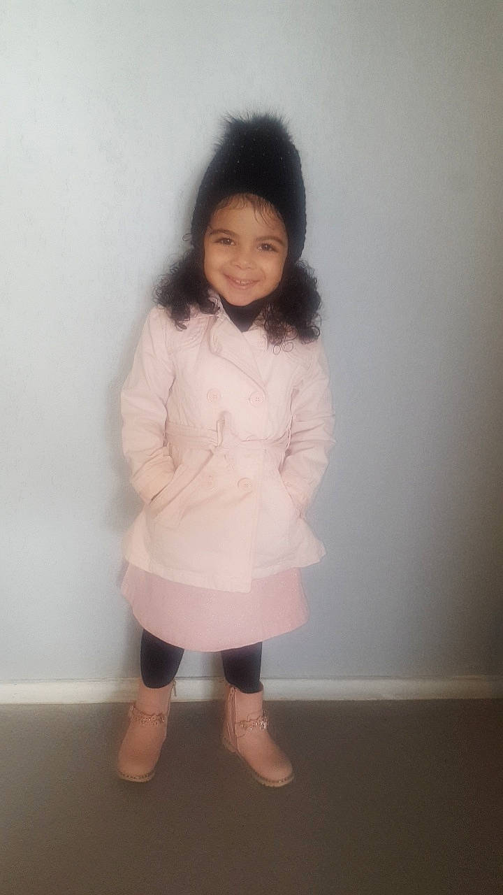 Mellina a rejoint le concours — aidez-le/la à gagner de superbes lots ! baby, black_hair, cheek, child, clothing, dress, face, fur, head, joy, knee, leg, long_hair, outerwear, person, pink, skin, sleeve, standing, thigh