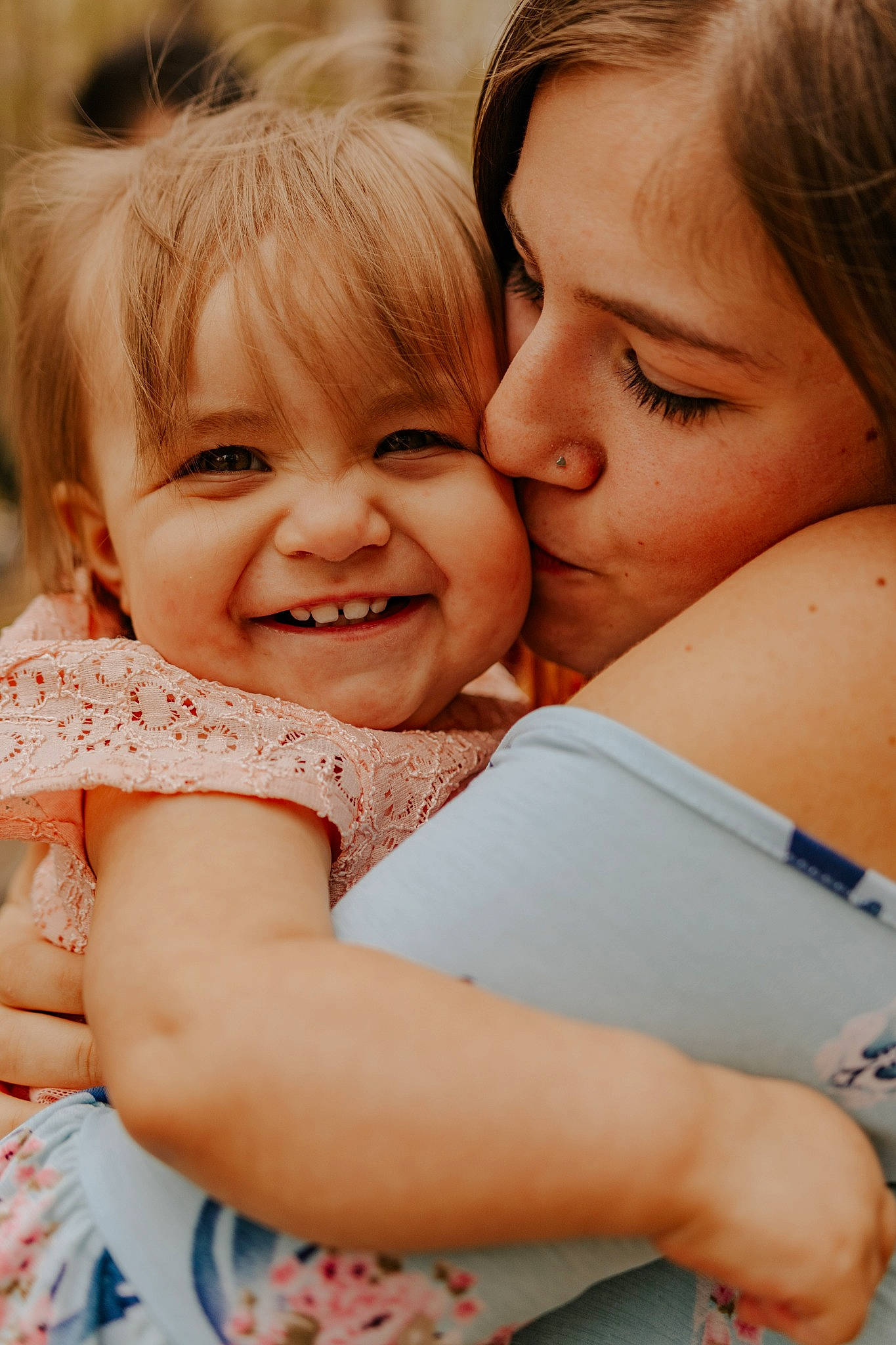 Harmony is registered to the contest to win money with this photo: cheek, comfort, eye, face, facial_expression, finger, gesture, hair, hairstyle, happy, head, interaction, iris, joy, leisure, nose, people_in_nature, person, playing_with_kids, product