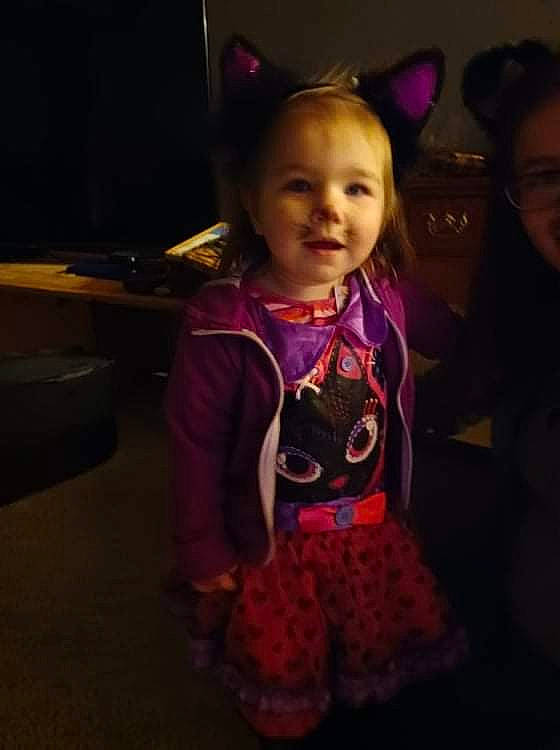 Davina is registered to the contest to win money with this photo: baby, baby_toddler_clothing, child, costume, darkness, electric_blue, entertainment, event, fashion_accessory, flooring, fun, happy, joy, magenta, pattern, person, pink, purple, smile, standing