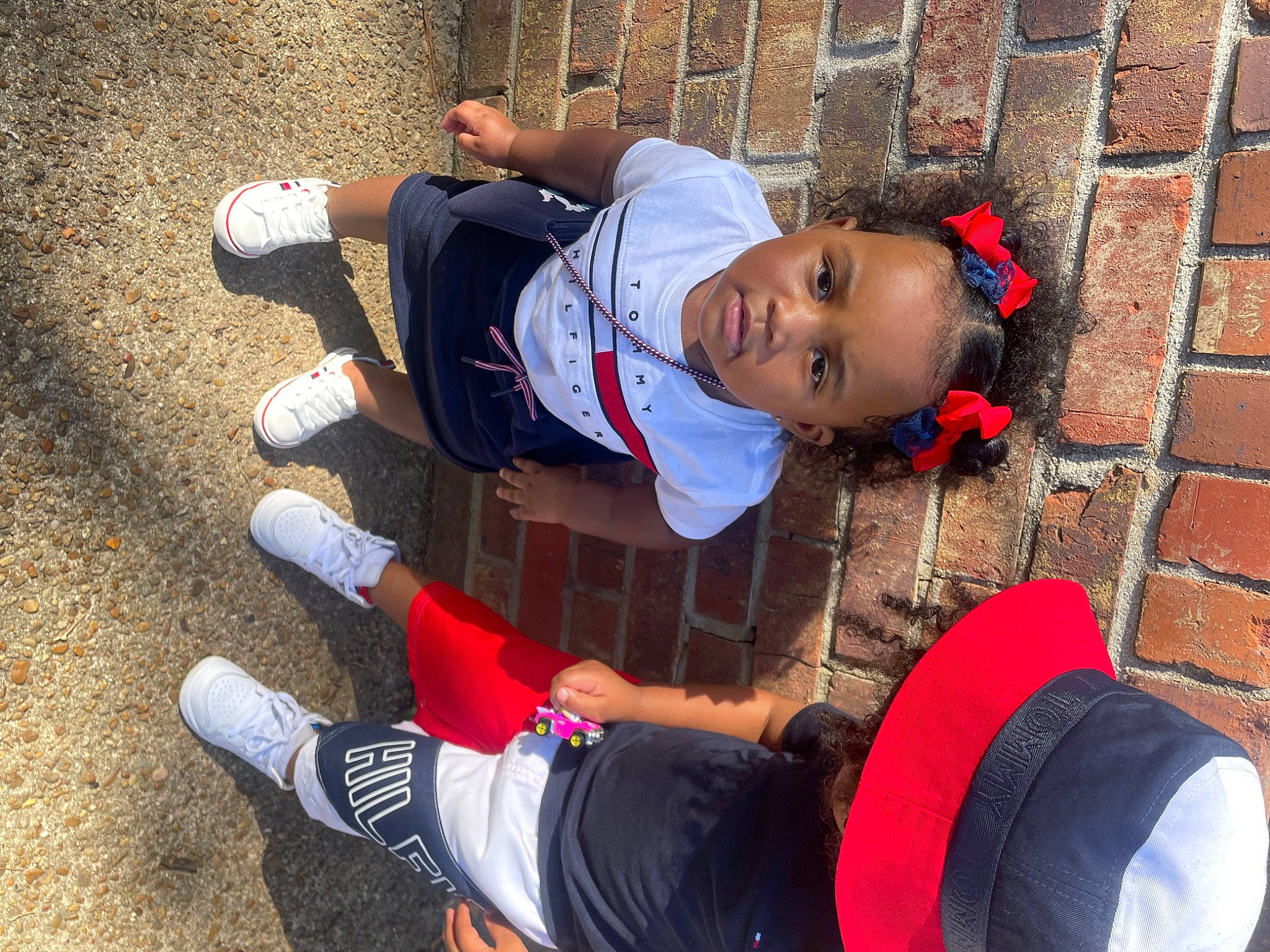 Alani is registered to the contest to win money with this photo: baseball_cap, boot, cap, carmine, clothing, fun, glove, hat, human_leg, knee, leg, leisure, person, red, shoe, sitting, sneakers, sock, t_shirt, thigh