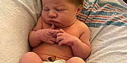 Avia is registered to the contest to win money with this photo: newborn, baby, sleeping, diaper, blanket, couch, infant, peaceful, cute, tiny, toes, skin, resting, child, indoors, soft, relaxed, young, portrait, cozy