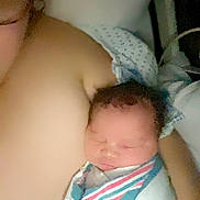 Avia joined the competition — help win amazing prizes! newborn, baby, swaddled, hospital_blanket, adult, glasses, hospital_gown, sleeping, face, skin, person, bed, resting, closeup, indoor, portrait, medical, parent, love, tenderness