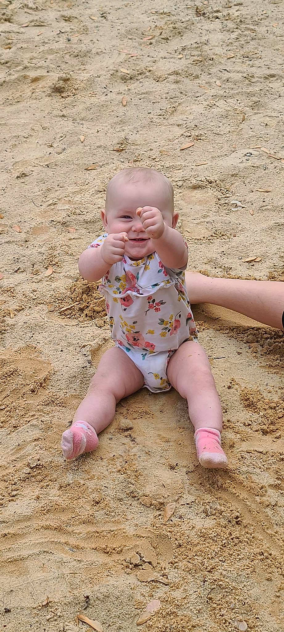 Catalina is registered to the contest to win money with this photo: arm, baby, baby_toddler_clothing, barefoot, chest, child, finger, foot, fun, gesture, grass, happy, human_leg, nail, people_in_nature, person, smile, soil, thigh, thumb