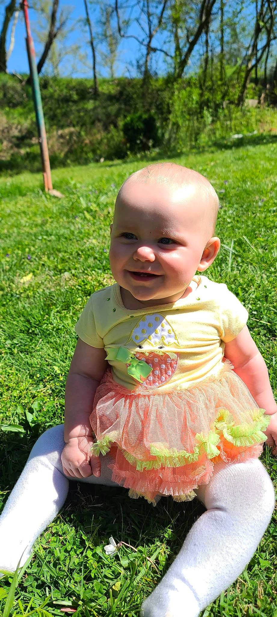 Catalina joined the competition — help win amazing prizes! baby, baby_toddler_clothing, cheek, child, dress, fun, grass, grass_family, green, happy, pattern, people_in_nature, person, photograph, pink, plant, sitting, skin, smile, summer