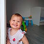 Ylliana participe au concours pour gagner de l'argent avec cette photo : baby, child, cute, door_frame, dress, face, floor, hair, hand, happy, indoor, nursery, person, playful, room, skin, smiling, strawberry_pattern, toddler, toy