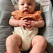 Asa joined the competition — help win amazing prizes! baby, infant, child, onesie, bib, cushion, seat, hands, legs, face, expression, indoor, cute, plush, comfort, skin, clothing, sitting, young, portrait