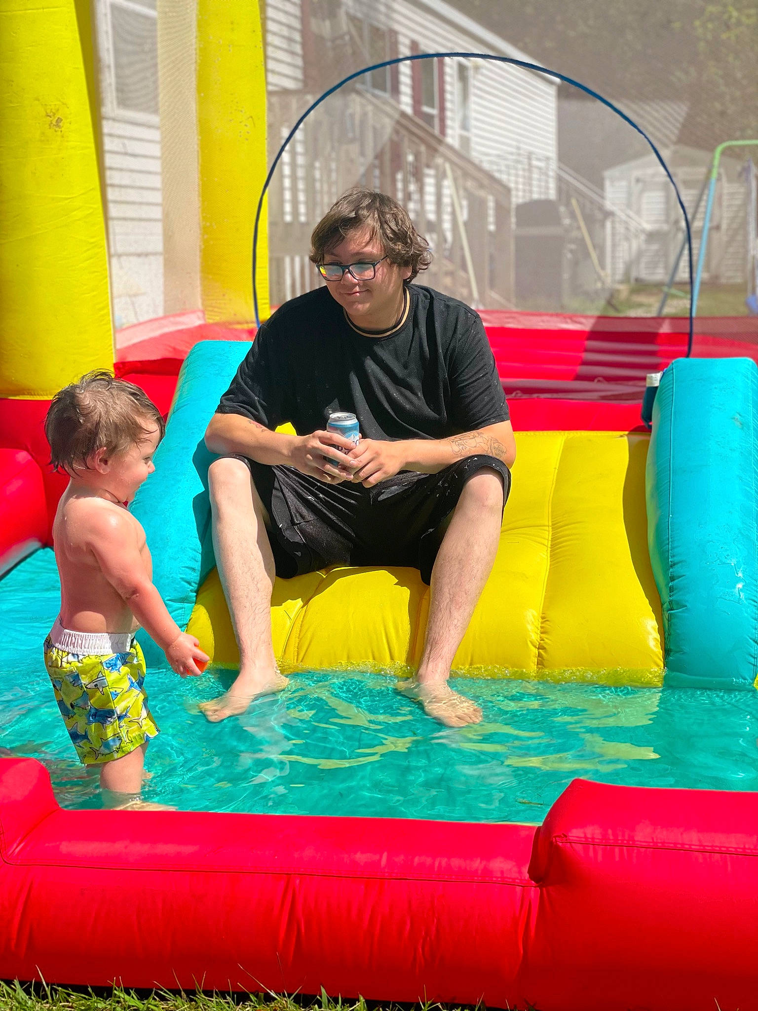 Gaige joined the competition — help win amazing prizes! aqua, beauty, bounce_house, child, chute, event, fun, games, happy, inflatable, leisure, nonbuilding_structure, person, play, playground, recreation, shorts, smile, toddler, vacation