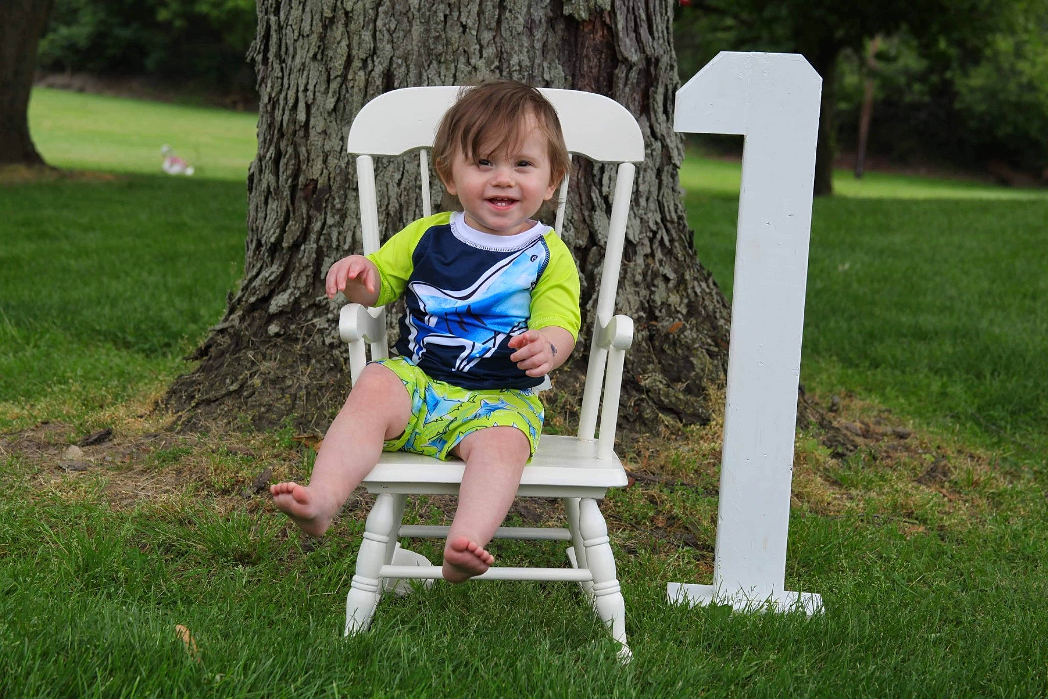 Gaige joined the competition — help win amazing prizes! baby_toddler_clothing, chair, child, face, folding_chair, grass, grass_family, green, happy, joy, lawn, leisure, people_in_nature, person, plant, recreation, shorts, sitting, smile, t_shirt