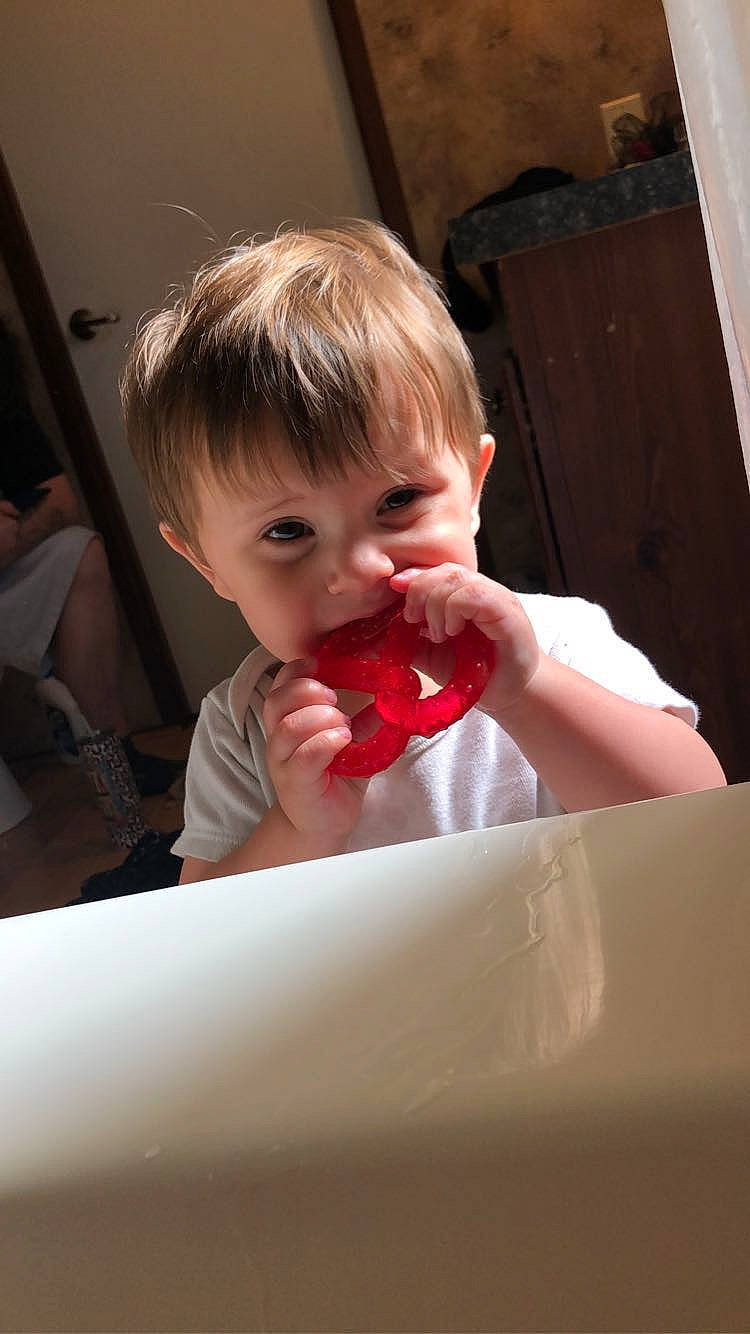 Gaige is registered to the contest to win money with this photo: baby, baby_toddler_clothing, carmine, cheek, child, comfort, fun, gesture, hairstyle, happy, lip, mouth, nail, nose, person, room, sitting, skin, smile, thumb