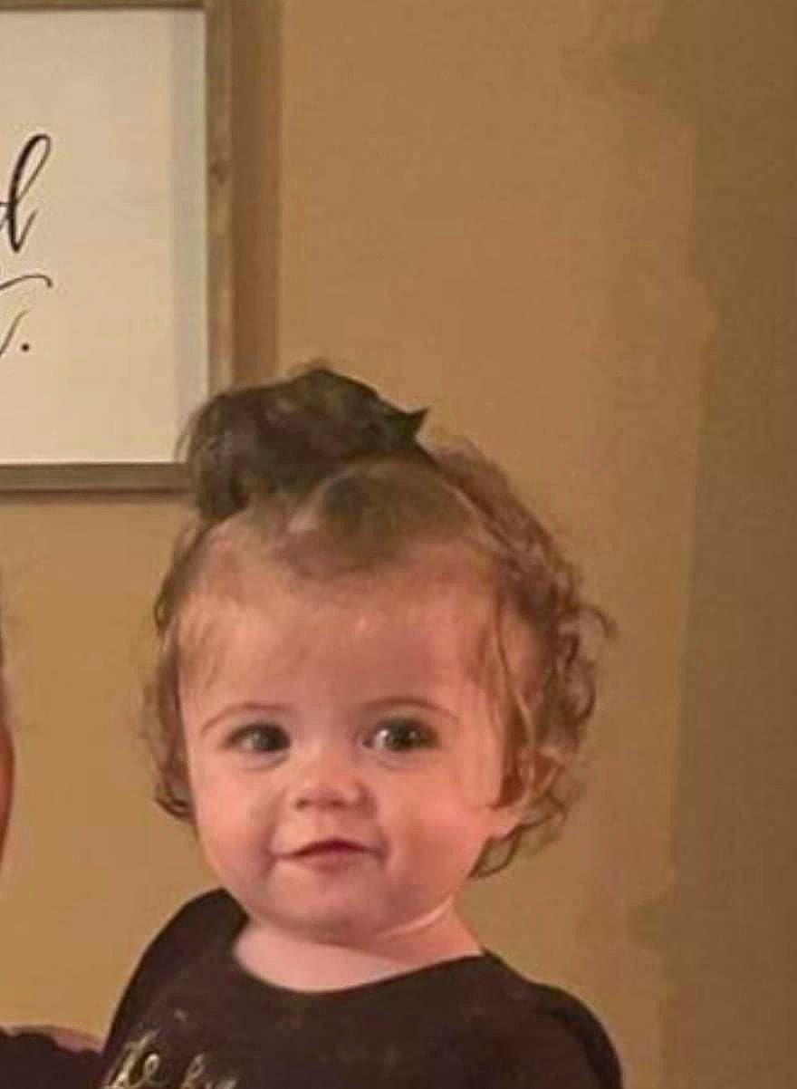 Julie is registered to the contest to win money with this photo: art, baby, baby_toddler_clothing, cheek, child, ear, event, eyelash, forehead, fun, hair, handwriting, happy, head, lighting_accessory, nose, person, room, smile, t_shirt