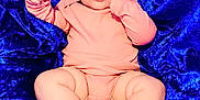 Larkyn joined the competition — help win amazing prizes! baby, infant, headband, bow, pink_clothing, blue_fabric, velvet, lying_down, chubby_legs, bare_feet, cute, portrait, child, soft_texture, curious_expression, indoors, closeup, person, skin, small_toes