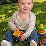 baby, ball, blocks, child, colorful, cute, grass, greenery, happy, jeans, long_sleeve_shirt, nature, outdoor, park, playtime, smiling, socks, stacking_toy, sunlight, toy