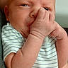 baby, newborn, infant, child, person, hand, face, skin, onesie, striped_clothing, cute, small, portrait, expression, holding, human, childhood, newborn_baby, sucking_thumb, closeup