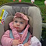 Elodie is registered to the contest to win money with this photo: baby, child, car_seat, pink_jacket, headband, blanket, flamingo, outdoor, grass, nature, bird, wildlife, curious, portrait, infant, cute, seatbelt, soft_texture, greenery, animal