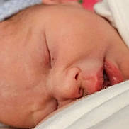 George is registered to the contest to win money with this photo: newborn, baby, sleeping, closeup, infant, blanket, hat, face, peaceful, soft, skin, portrait, rest, child, cute, cozy, indoors, young, headwear, wrapped