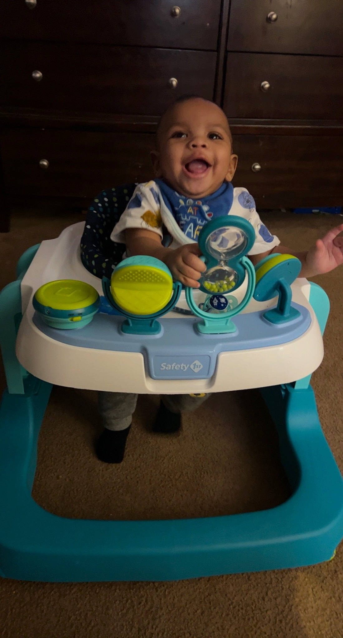 Kyrie is registered to the contest to win money with this photo: baby, baby_playing_with_toys, baby_products, baby_safety, baby_toddler_clothing, baby_toys, child, comfort, fun, happy, leisure, person, plastic, play, product, recreation, sitting, smile, t_shirt, table