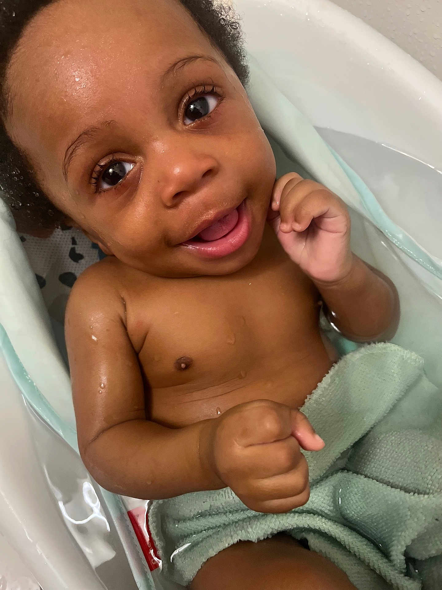 Giovanni is registered to the contest to win money with this photo: baby, child, smiling, bath, water, towel, skin, happy, cute, infant, portrait, closeup, wet, indoors, person, young, face, expression, hand, relaxation