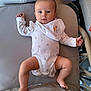 Esme joined the competition — help win amazing prizes! baby, infant, onesie, bib, cushion, chair, indoor, person, face, legs, feet, hand, plush, comfortable, cute, young_child, expression, looking, casual, resting