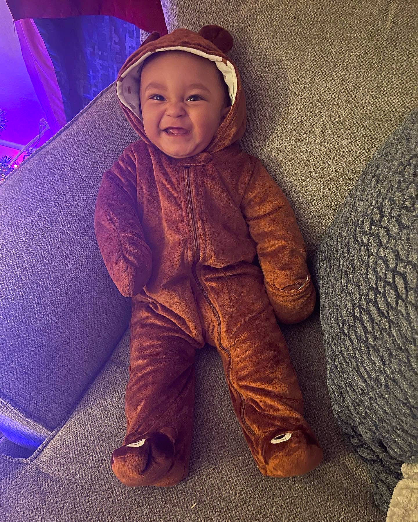 Norman is registered to the contest to win money with this photo: cap, comfort, electric_blue, fashion_accessory, flash_photography, flooring, fun, happy, headgear, headwear, human_body, human_leg, magenta, person, personal_protective_equipment, selfie, sitting, sleeve, smile, tints_and_shades