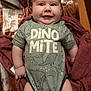 Lucious joined the competition — help win amazing prizes! baby, smiling, onesie, dinosaur_print, blanket, cute, child, infant, happy, lying_down, clothing, portrait, cheeks, arms, legs, indoor, soft_toys_pattern, cozy, cute_expression, young_child